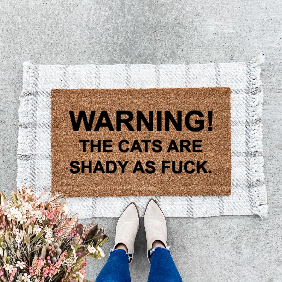 Cat Is Shady As F*ck Doormat